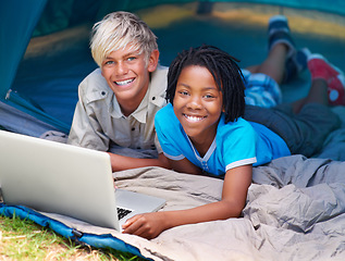 Image showing Children, boys and happy with laptop for camping tent, social media and online movie with portrait in nature. Friends, face and kids with smile outdoor on grass for gaming, relax and holiday fun