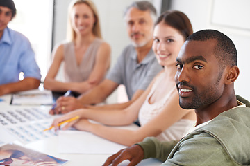 Image showing Magazine, design and portrait of team in meeting with man on project, collaboration and creative planning. Happy, staff and photography work on table with catalog, portfolio and editing process