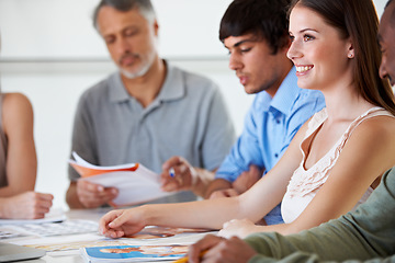 Image showing Team, creative business people and happy woman planning at desk in meeting, brainstorming strategy or thinking of idea in startup office. Group, designers at table or collaboration for photography