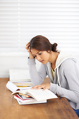 Image showing Student, woman and reading with books for study, knowledge and confused with notes for learning in bedroom..Young person, girl and frustrated at desk and novel for scholarship, project and assessment