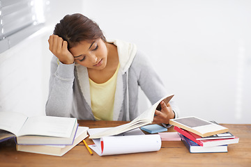 Image showing Student, woman and reading with books for learning, knowledge or education with idea for study in bedroom..Young person, girl and stress at desk with novel for scholarship, project or assessment test