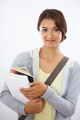 Image showing Portrait, student and woman with books in studio isolated on a white background. Face, textbook and young person in university for education, knowledge or learning in college on scholarship in Brazil