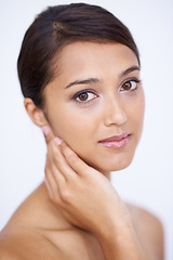 Image showing Portrait, cosmetics and woman with skincare, dermatology and grooming on a white studio background. Face, Indian person and model with shine and soft with healthy skin, smooth and aesthetic with glow