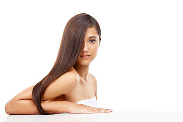 Image showing Hair care, portrait and young woman in studio for cosmetic, salon and beauty treatment. Wellness, confident and female person with healthy and shiny hairstyle routine by white background with mockup.