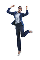 Image showing Business winner, portrait and black woman jump in air for celebration of goal achievement in studio isolated on a white background. Cheers, yes or excited person leap in victory, success or promotion