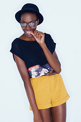 Image showing Portrait, funny and black woman with fashion, glasses and stylish clothes on a white studio background. African person, girl and model with eyewear and casual outfit with gen z and goofy with fun