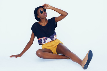 Image showing Fashion, sunglasses and black woman on the floor, relaxing and hipster on a white studio background. African person, model and girl with stylish clothes and funky eyewear with mockup space and trendy