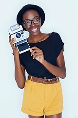 Image showing Woman, photographer and portrait in studio with retro camera, creativity and happy artist with creative talent. African person, positive face or vintage film in photoshoot or lens by white background