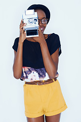 Image showing Woman, photographer and happy in studio with vintage camera, creativity and media for artist with creative talent. African person, positive and retro film for photoshoot and focus by white background