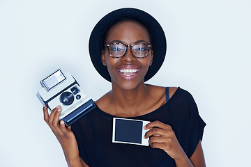 Image showing Black woman, photograph and portrait in studio with camera, creativity and media for artist with creative talent. Young person, happiness and face for photoshoot, lens and focus by white background