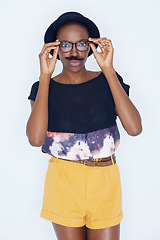 Image showing Cool, woman and portrait with mustache in studio with hipster fashion and funny model in background. African, person and silly nerd with goofy style and joke with trendy hat or unique outfit