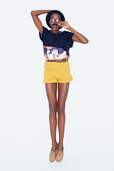Image showing Portrait, fashion and mustache with silly black woman in studio on white background for comedy or humor. Comic, glasses and eccentric young person with funny, goofy or quirky accessories for style