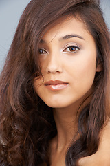 Image showing Portrait, care and beauty of woman with hair in studio isolated on a grey background. Face, aesthetic and hairstyle of model in makeup cosmetics, hairdresser and salon treatment for skin glow