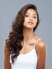 Image showing Hair care, woman and portrait or beauty in studio with keratin treatment, soft texture and shampoo shine. Model, Indian person and face with hairstyle, cosmetics and collagen glow on white background