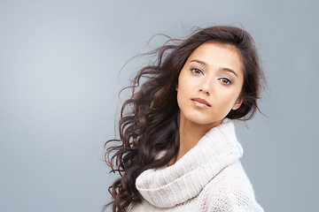 Image showing Serious, woman and portrait for hair care, beauty and healthy glow on skin in gray background of studio. Dermatology skincare and girl with shine on face from makeup, treatment and Brazil mockup