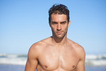 Image showing Man, portrait and beach for swimming, workout or outdoor exercise by the ocean coast in summer. Face of muscular male person or professional swimmer for on holiday weekend or vacation by the sea