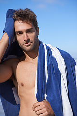 Image showing Serious, beach and portrait of man with towel for swimming in ocean on vacation, holiday or adventure. Travel, handsome and young person by sea with confidence for summer weekend trip in Australia.