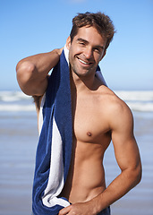 Image showing Smile, beach and portrait of man with towel for swimming in ocean on vacation, holiday or adventure. Happy, handsome and young male person by sea with confidence for summer weekend trip in Australia.