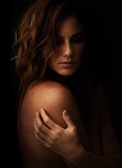 Image showing Woman, body and skincare in studio for beauty, dermatology and shadow or light for art deco and aesthetic. Cosmetics model or serious person with self care and creative on a dark or black background