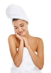 Image showing Towel, beauty and relax woman with satisfaction for cosmetics, aesthetic makeup and facial collagen. Bathroom, eyes closed and model happy for skincare shine, hygiene or grooming on white background