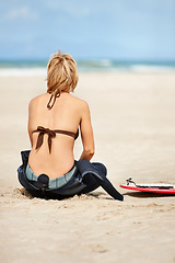 Image showing Surfing, beach and back of woman with surfboard for water sports training, wellness and fitness by ocean. Nature, relax and person on sand for adventure on holiday, vacation and hobby by sea waves