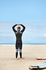 Image showing Surfing, stretching and man with surfboard on beach for water sports training, freedom and fitness outdoors. Nature, exercise and person warm up for adventure on holiday, vacation and hobby by sea