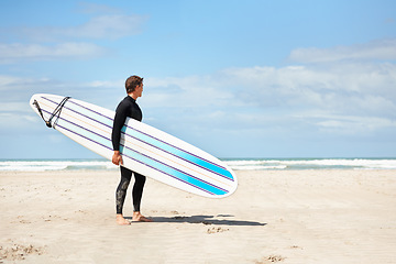 Image showing Surfing, thinking and man with surfboard on beach for water sports training, wellness and fitness by ocean. Nature, sky and person with mockup space for adventure on holiday, vacation or hobby by sea