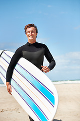 Image showing Beach, portrait and happy man with surfboard for fitness exercise workout or body health in summer outdoor. Surfer, wetsuit and person by ocean for water sports, travel or holiday vacation in Hawaii