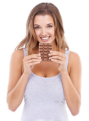 Image showing Woman, eating chocolate and portrait with candy, face and pleasure for craving sugar in white background. Happy, snack and smile for comfort, dessert or sweets for calories, diet or tempting