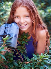 Image showing Nature portrait, binocular and child smile for travel adventure, outdoor exploration or bird watching trip. Smile, tree leaves and face of kid on search journey in green forest, woods or eco jungle