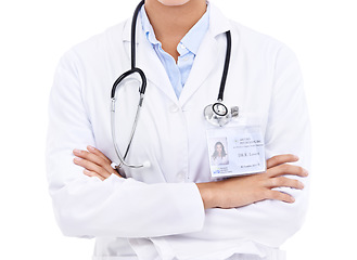 Image showing Doctor, hands or arms crossed in studio with confidence in medical career as cardiologist. Proud person, coat or body of medicine consultant with name tag or healthcare isolated on white background