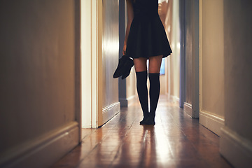 Image showing Woman, legs and walking with shoes in hallway for fashion, clothing or outing at home. Closeup of young female person in dress and leggings by door for sneaking, silence or quiet foot steps at house