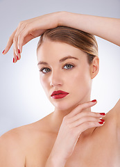 Image showing Woman, portrait and skincare in studio with red lipstick for cosmetics, beauty and aesthetic with nail polish. Model, person and confidence with makeup, glowing face and wellness on white background