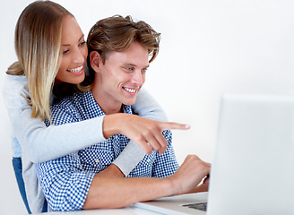 Image showing Couple, laptop and hug with video, online information and social network scroll in a studio. Marriage, computer and tech with web research, support and love on the internet with white background