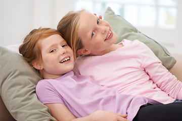 Image showing Girl children, sisters and couch portrait, bonding with love and care at family home, trust and support. Friends, smile and time together in living room, relax on sofa with happiness and hug