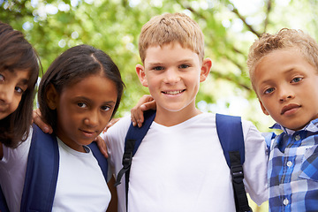 Image showing Children, hug and pride in happy portrait, outdoor trees and sunshine with wellness on playground. Kids, together and back to school in diversity on field, education and summer in solidarity in town