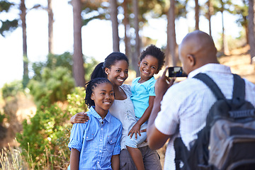 Image showing Happy black family, photographer and nature for hiking, bonding or outdoor together for photo. African mother, children and father smile taking picture on phone for photography or adventure in nature