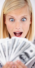 Image showing Excited, woman wow and money with dollars, investment and savings for budget with reward. Wealth, wondering and happy person smile with cash profit from work bonus in studio with white background