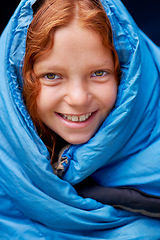 Image showing Sleeping bag, camping and portrait of child in tent for rest, relax and comfortable in gear. Travel, youth and face of ginger girl in sleep sack for adventure on holiday, vacation or weekend outdoors