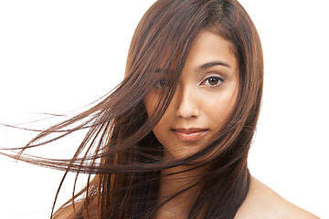 Image showing Hair care, woman and portrait or confident in studio with keratin treatment, soft texture and beauty shine. Model, Indian girl and face with hairstyle, cosmetics and collagen glow on white background