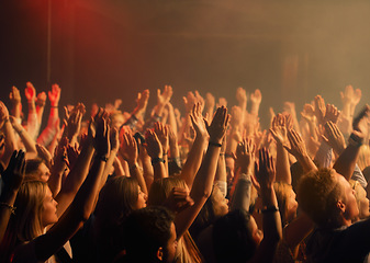 Image showing Festival, night dance and outdoor with crowd at party and event in the dark with excitement and screaming. Freedom, social and people at concert with techno and music in an audience with celebration