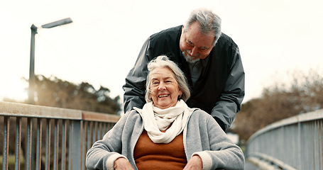 Image showing Senior couple, nature and in a wheelchair on a walk for happiness, retirement date or love. Smile, talking and an elderly man and woman with a disability and in a park to relax together in marriage