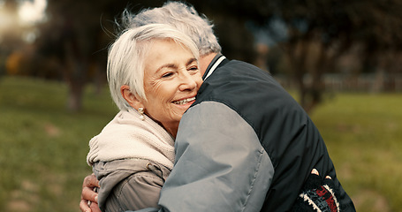 Image showing Love, nature and smile with a senior couple hugging outdoor in a park together for a romantic date during retirement. Happy, support and an elderly man and woman bonding in a garden for romance