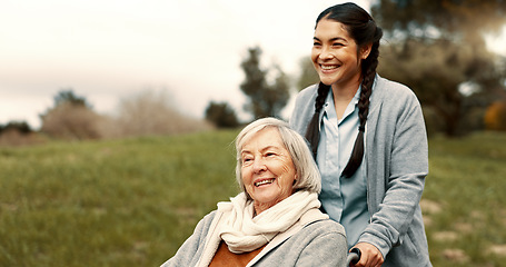 Image showing Happy, senior woman and outdoor with caregiver, nurse or healthcare service for person with a disability and wheelchair. Face, smile and elderly lady in park with care or support in retirement