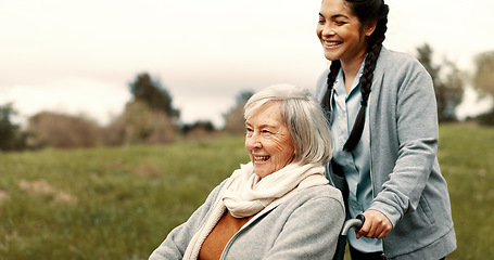 Image showing Happy, senior woman and outdoor with caregiver, nurse or healthcare service for person with a disability and wheelchair. Face, smile and elderly lady in park with care or support in retirement