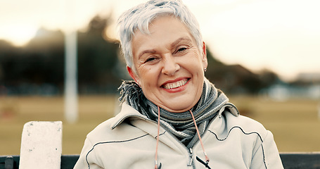 Image showing Face, senior woman and funny on park bench on vacation, holiday or travel in winter. Portrait, happy and elderly person in nature, outdoor or garden for laughing, freedom and retirement in Australia