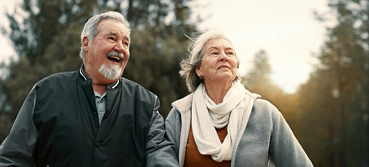 Image showing Love, smile and a senior couple walking outdoor in a park together for a romantic date during retirement. Happy, care or excited with an elderly man and woman bonding in a garden for romance