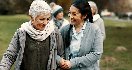 Image showing Happy, walking and a woman and caregiver in nature for talking, support and relax in the morning. Help, together and a young carer speaking to a senior patient in a park or garden for bonding