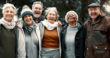 Image showing Happy, portrait and senior friends in a park while walking outdoor for fresh air together. Diversity, smile and group of elderly people in retirement taking picture and bonding in a forest in winter.