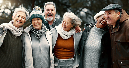 Image showing Happy, portrait and senior friends in a park while walking outdoor for fresh air together. Diversity, smile and group of elderly people in retirement taking picture and bonding in a forest in winter.